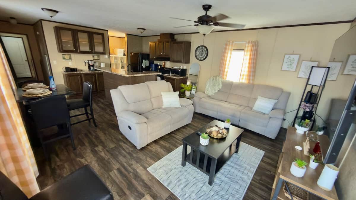 Bright open-concept living, dining and kitchen area at Winter Haven Comfort Retreat